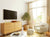 bright living room with TV - interior decor tips from movies - GearDen