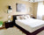 minimalist bedroom, romantic bedroom, beige walls, couple wall art -- real homes decorated by Gear Den customers