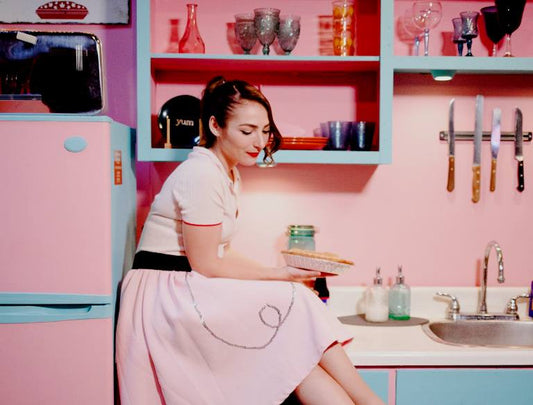 woman in colorful kitchen - 2024 kitschen trend - GearDen