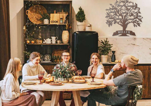 grateful family at dining table with custom metal decor - Thanksgiving 2024 gratitude list