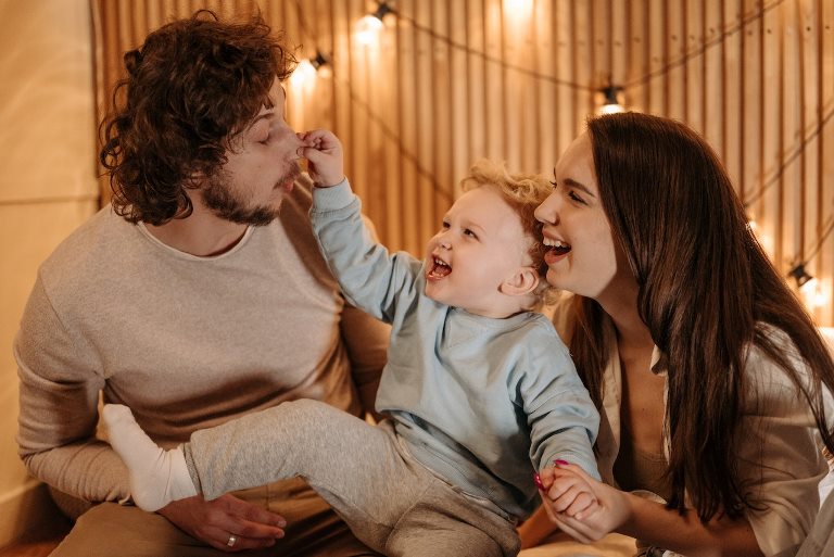mom, dad, and baby being silly - Gear Den family tips