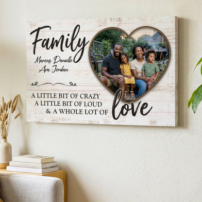 Personalized family photo canvas with a family of four in a heart, names and a whole lot of love wording, hanging on a living room wall