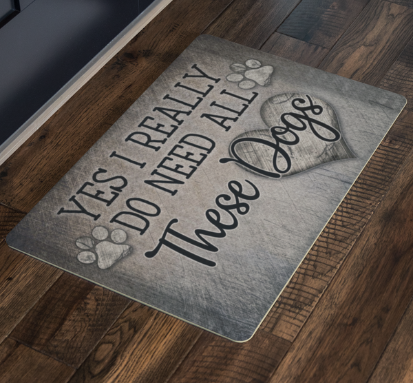floor with doormat that says "Yes, I really need all these dogs" - Gear Den
