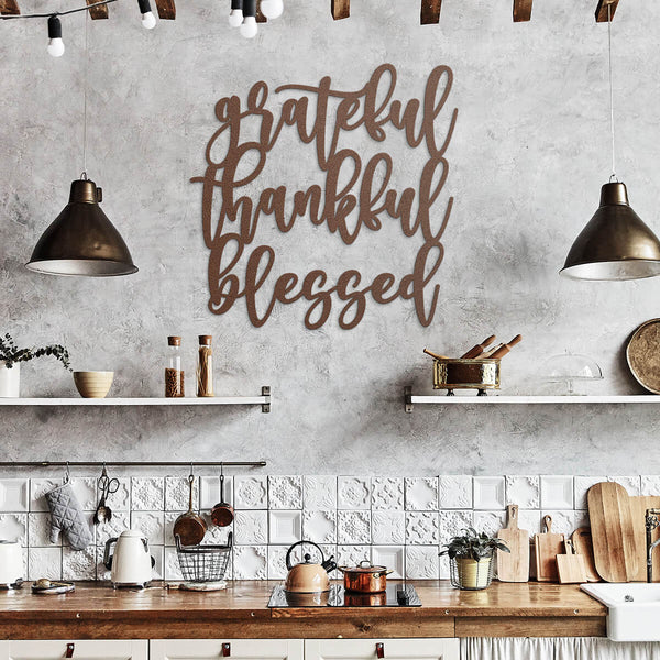rustic kitchen with concrete walls, white tiles, wood countertop, and metal art that says "grateful, thankful, blessed" - Gear Den