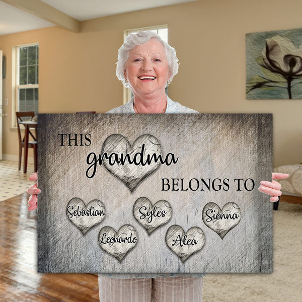 https://gearden.com/cdn/shop/products/this-grandma-belongs-to-personalized-with-names-on-hearts-horizontal-sofa-holding_600x.jpg?v=1605192066